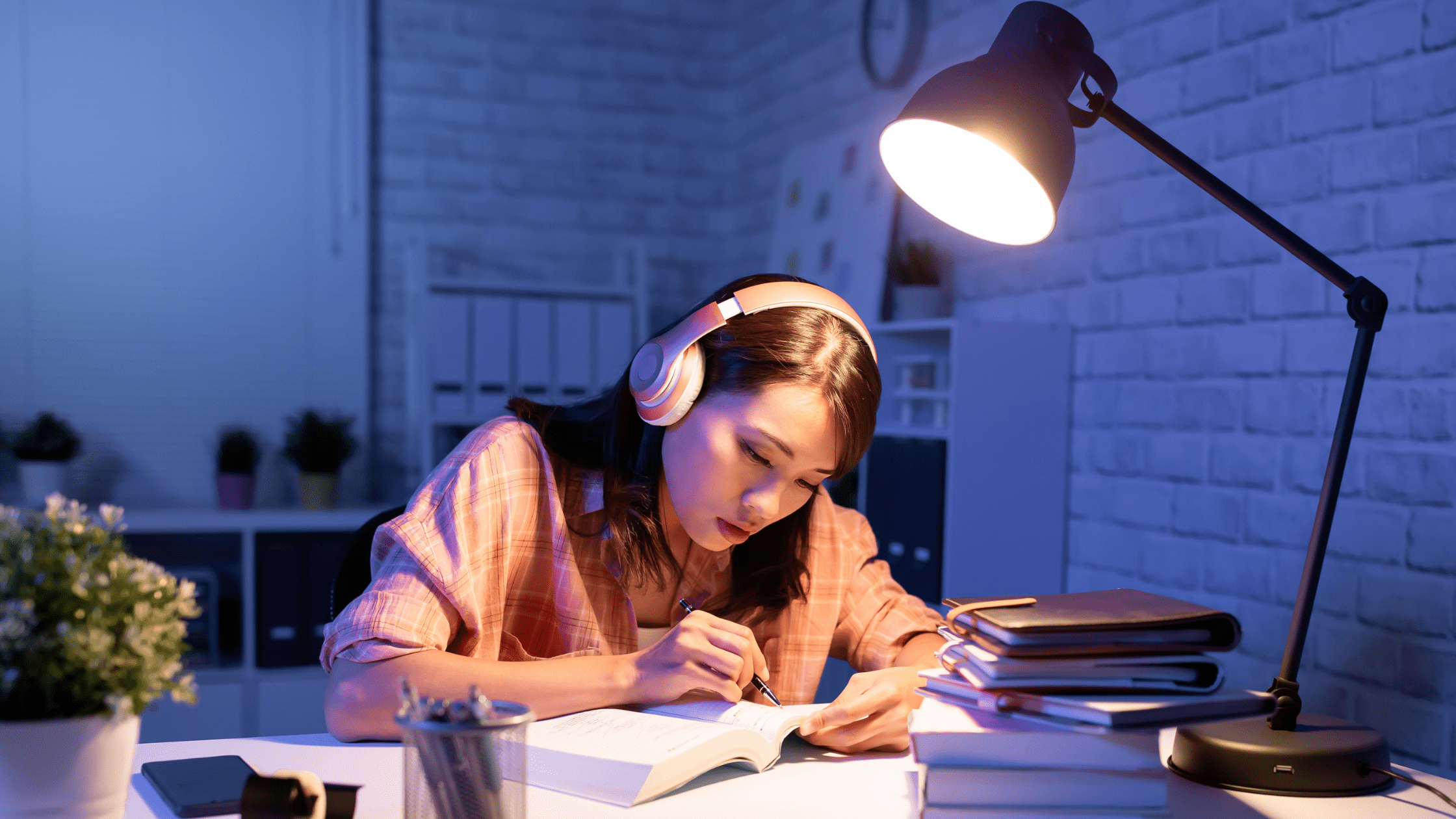 A Medical student studying at night preparing for USMLE and COMLEX Simultaneously.